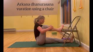 Akarna dhanurasana variation using a chair