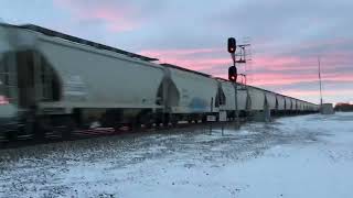 BNSF ACE leads an Westbound sand train in the sunset knocking down signal Near Glyndon MN