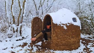 Building a bushcraft shelter for winter survival in the wilderness