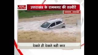 a car swept away in water in Ramnagar, Uttarakhand