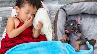 See how happy baby Diem and dog Mun sleep together