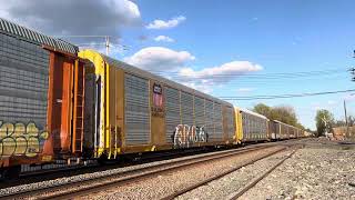 CSX 849 ES44AH leads CSX M403 through south Plainfield,NJ with a friendly crew!