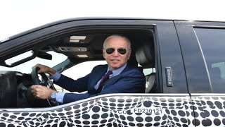 President Biden drives Ford's new electric pickup truck at the Michigan plant