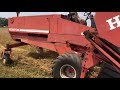 swathing organic oats heston 6450 swather with draper head.