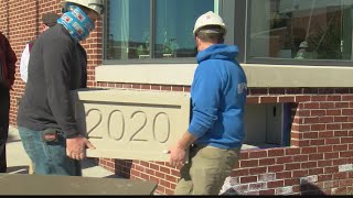 Altoona Area High School placing time capsule in cornerstone