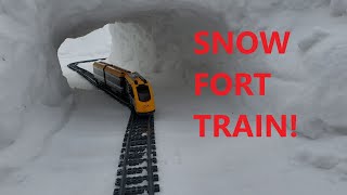 Lego train travels through our 2022 snow fort