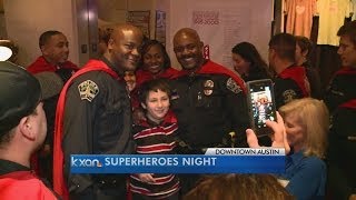 Austin Police officers wear capes for kids