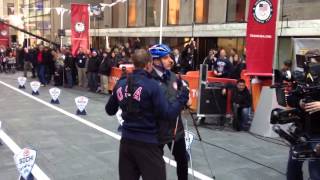 Olympian Billy Demong and Matt Lauer skiing on wheels at the plaza