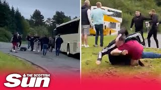 Shocking moment Rangers & Hearts fans clash after supporters’ buses stop at service station