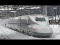 bullet train comes one after another on a snowy day