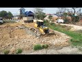 Dozer Shantui DH17-C2 Clearing Mud In The City And Unloading Dirt By Shacman 10 Wheel Dump Trucks