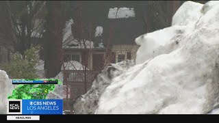 Trapped residents in San Bernardino Mountains see rain on top of snow