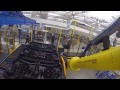 heavy duty robotic truck unload system offloads large automotive modules