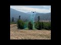 flying an xag v40 drone with rotary atomizer during a spray demonstration in british columbia