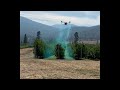 flying an xag v40 drone with rotary atomizer during a spray demonstration in british columbia