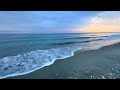 beach walk after the snow storm over the dune to enjoy the crashing waves at the water s edge