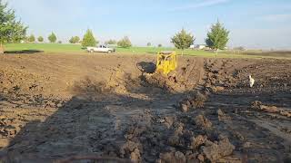 Cat D5b pushing a new pond for livestock.