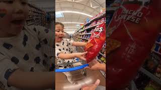 Shop! Chloe realized the Doritos she had were small and wanted to swap for a larger package.