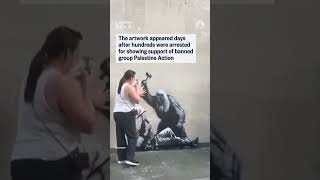 Banksy painted a mural on London's High Court depicting a judge beating a protester