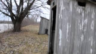 Why do outhouses have two holes ?