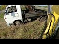 desilting the drainage ditch with an excavator and sludge transportation by truck