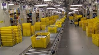 Watch Robots Work at Amazon Warehouse Where Cyber Monday Deals Are Packaged