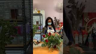 Creating a Bi-color Gerbera Daisy and Red Rose flower arrangement