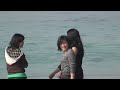 burmese chinese girls playing with water at ngapali beach.m2ts