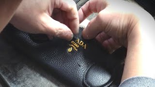 The process of remodeling an old and worn Prada bag into a new one / Masterpiece repairman