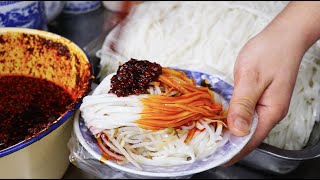 Chinese cuisine Shaanxi rice noodles, with red pepper oil and vinegar added, very delicious