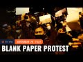 Blank sheets of paper become symbol of defiance in China protests