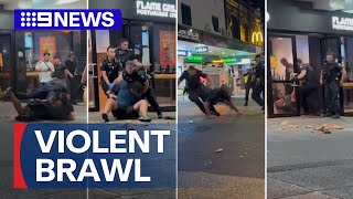 Queensland police officers rushed to hospital after violent brawl | 9 News Australia