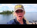 girls trip catching giant pike on rainy lake