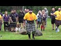Strongmen take the Nicol Stone carry challenge during 2019 Donald Dinnie Games in Scotland