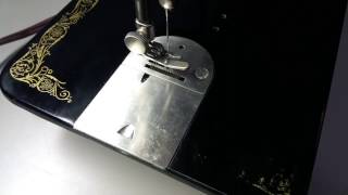 Remove Singer 66 bobbin case in less than 60 seconds.
