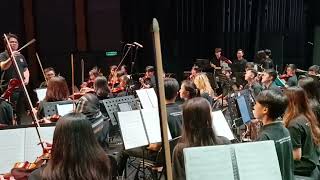 SKOC orchestra is performing this TV song that involves backstabbing