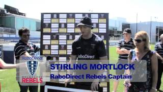 Harold Mitchell makes a presentation to Stirling Mortlock