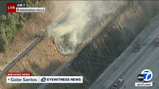 Small grass fire erupts in Granada Hills near 405