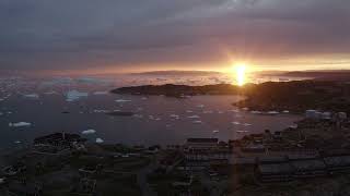 Aerial view of Ilulissat Icefjord in Western Greenland at sunset - Stock Footage