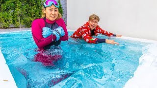 I FROZE MY SWIMMING POOL WITH 7,000 POUNDS OF ICE!!