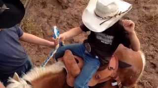 Mini Bronc Riding-7 yr old Trace Barrett.