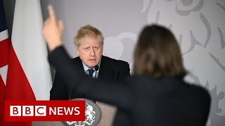 UK PM Boris Johnson confronted by tearful Ukrainian - BBC News
