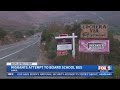 Migrants attempt to board school bus