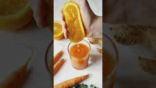 A Hand Squeezing an Orange