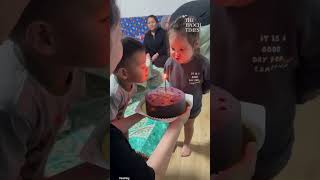 Young girl tries to use her supervision to put out the candles on her birthday cake 😂