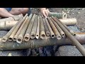 a man made a xiao flute with mountain bamboo.