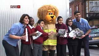 Schoolchildren Learn about Fire Safety through Lion Mascot