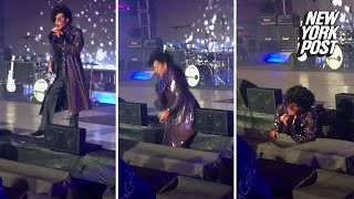 Prince impersonator falls off stage | New York Post