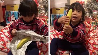 Excited Toddler Gets Banana For Christmas