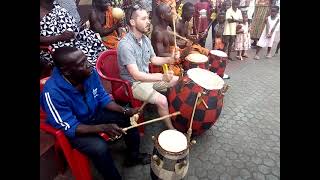 A white man playing there Asante Kete drum ‎@ASANTE HERITAGE TV 